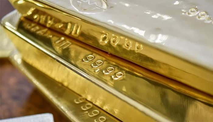 Gold ticks higher as nerves over US tax bill hit dollar