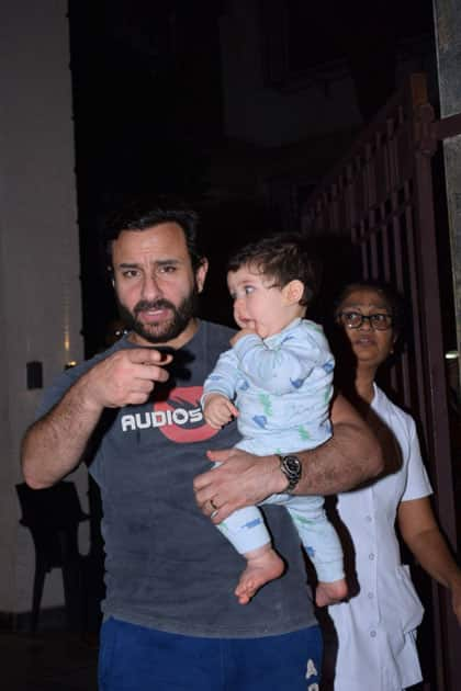 Actor Saif Ali Khan along with his son Taimur Ali Khan at Actress Soha Ali khan's residence on the occasion of her birthday in Mumbai.