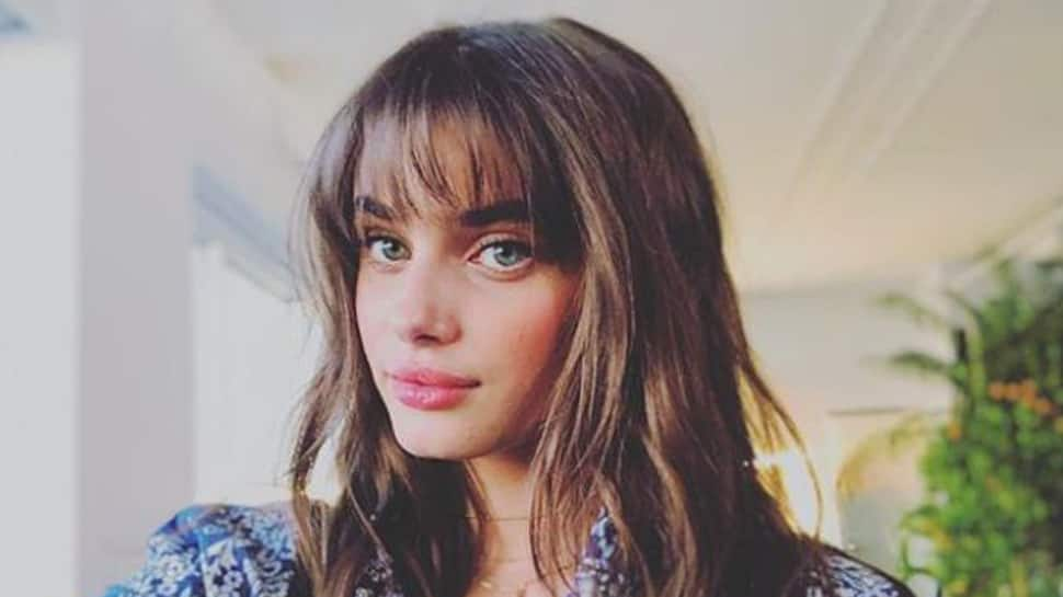 Taylor Hill keeps her tags on her clothes