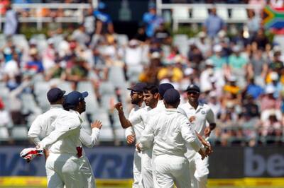 The Indian team celebrates the taking of South African wicket during the Ist day of the first cricket test match at Newlands Stadium in Cape Town, South Africa.