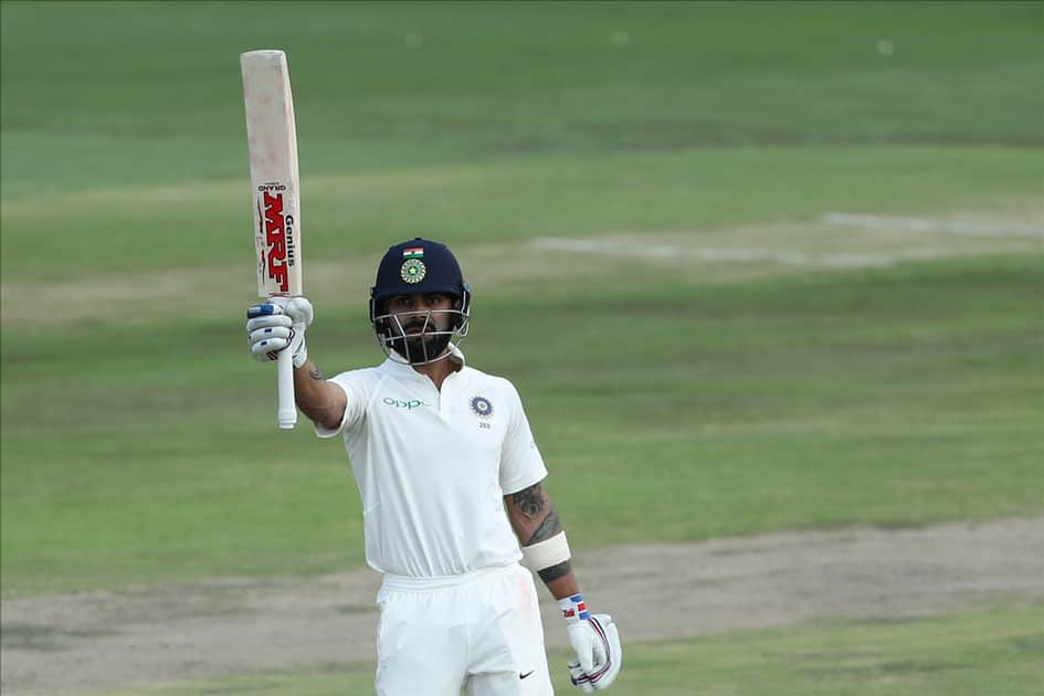 Indian captain Virat Kohli celebrates his half century during the second day of the second Test match between South Africa and India at the Supersport park Cricket Ground in Centurion, South Africa.