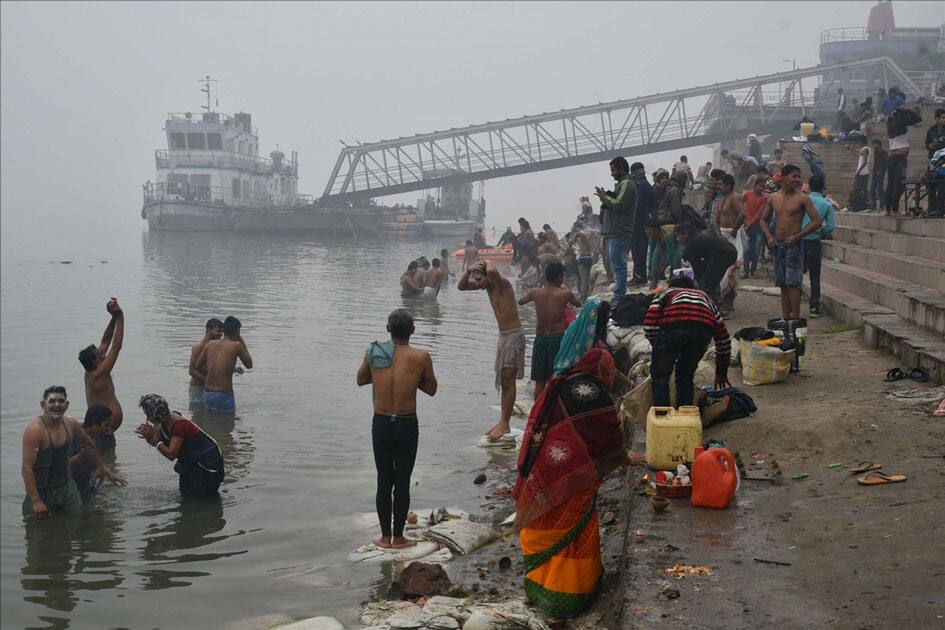 Devotees perform rituals on the banks of Ganga river on Makar Sankranti in Patna.