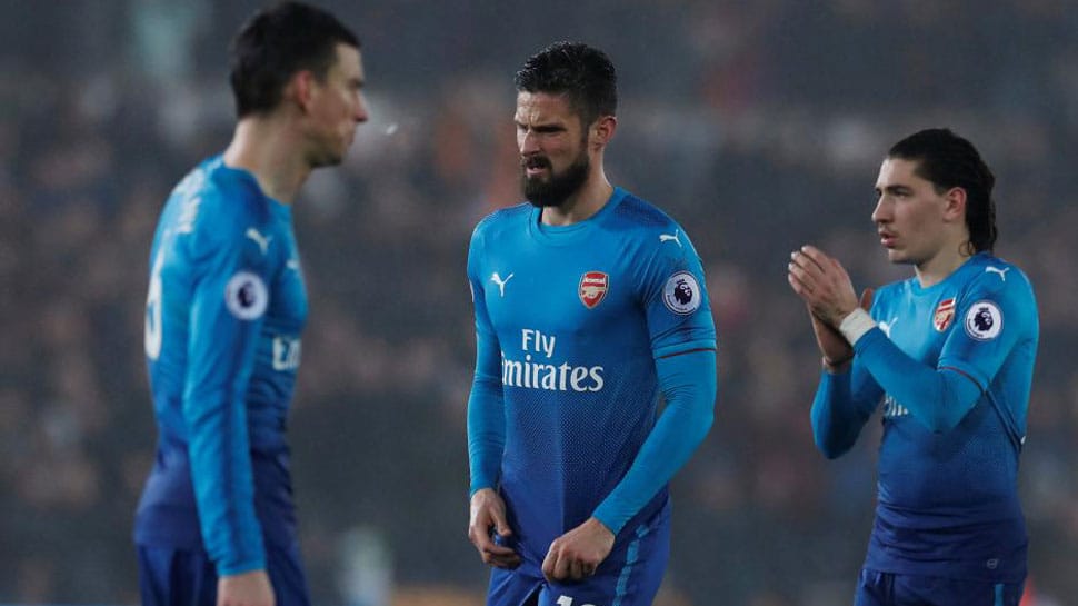 English Premier League: Arsenal shocked by Swansea City, Liverpool cruise to win