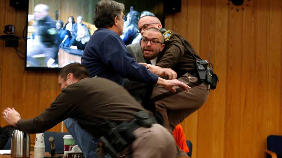 Larry Nassar sentencing hearing halted as father lunges at disgraced doctor Larry Nassar sentencing hearing halted as father lunges at disgraced doctor