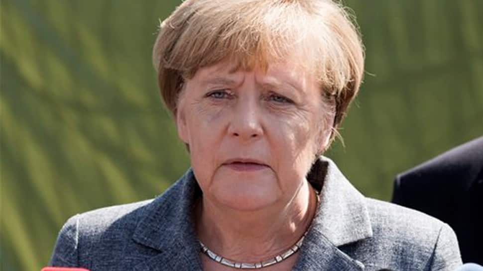 Angela Merkel quells party rebellion ahead of coalition deal vote