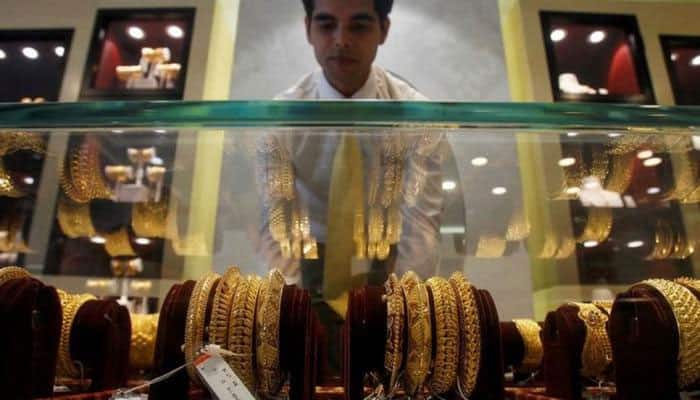Silver falls on muted demand, gold ends steady