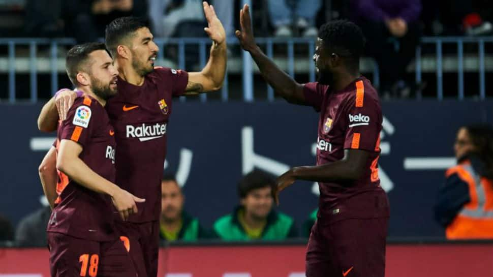 La Liga: Barcelona stroll past Malaga without Lionel Messi