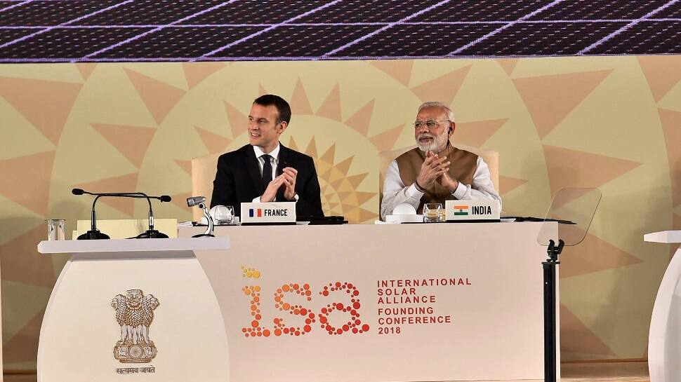 Emmanuel Macron takes a dig at Donald Trump for leaving Paris Accord; hails India&#039;s efforts