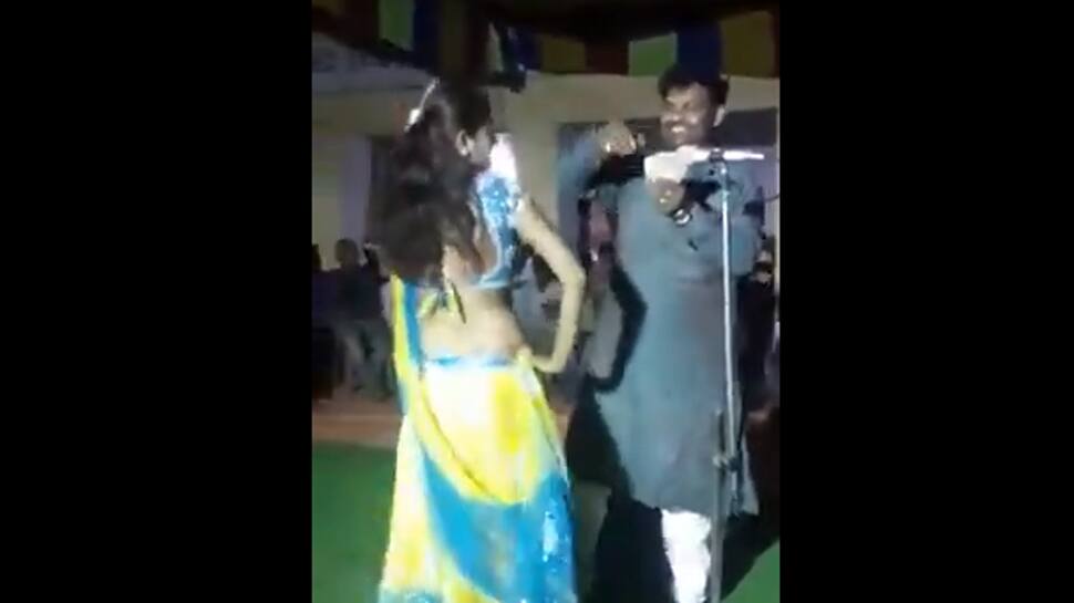Watch: RJD leader dances, misbehaves with female performer, throws away cash