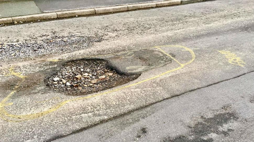 Man draws human organs around potholes to 'wake up authorities' Man draws human organs around potholes to 'wake up authorities'