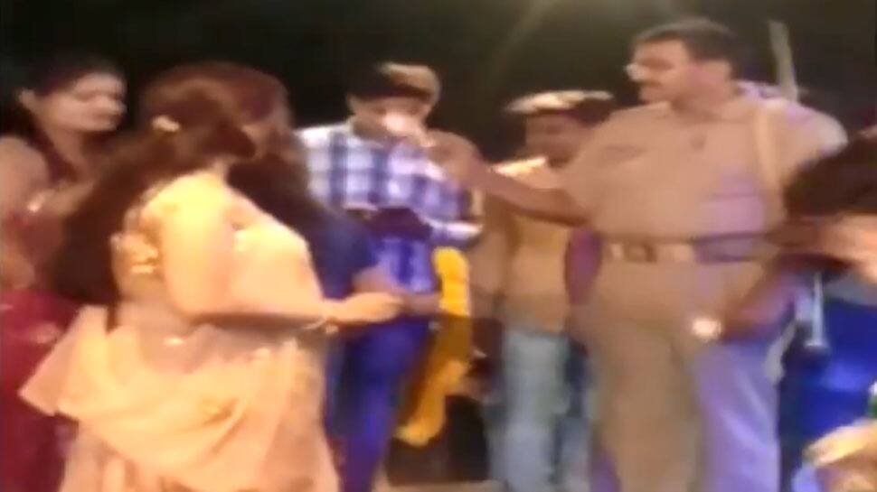 Caught on camera: UP cop shower notes on dancers during event in Unnao