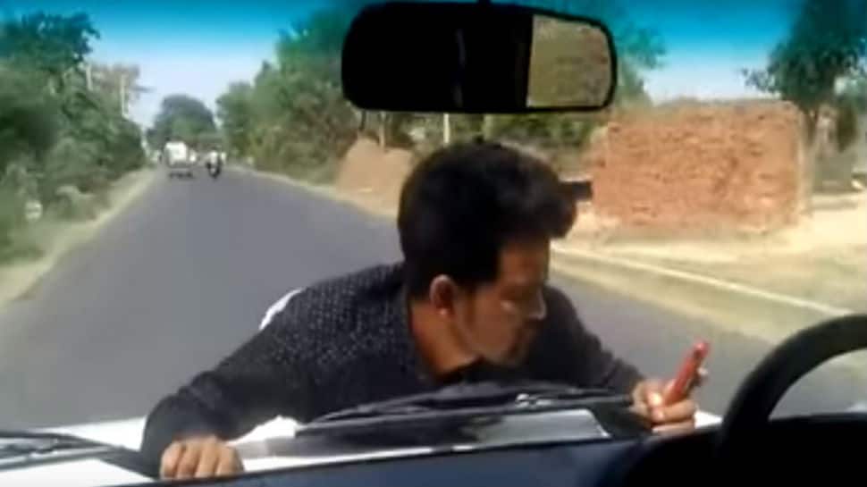 Watch: Shocking video shows government official driving with protesting man on bonnet