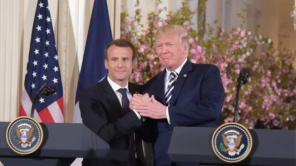 To make French President &#039;perfect&#039;, Donald Trump brushes dandruff off Emmanuel Macron&#039;s jacket