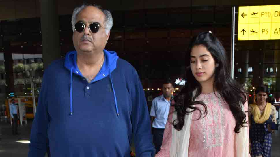 Janhvi Kapoor walks hand-in-hand with father Boney as they arrive back in Mumbai 