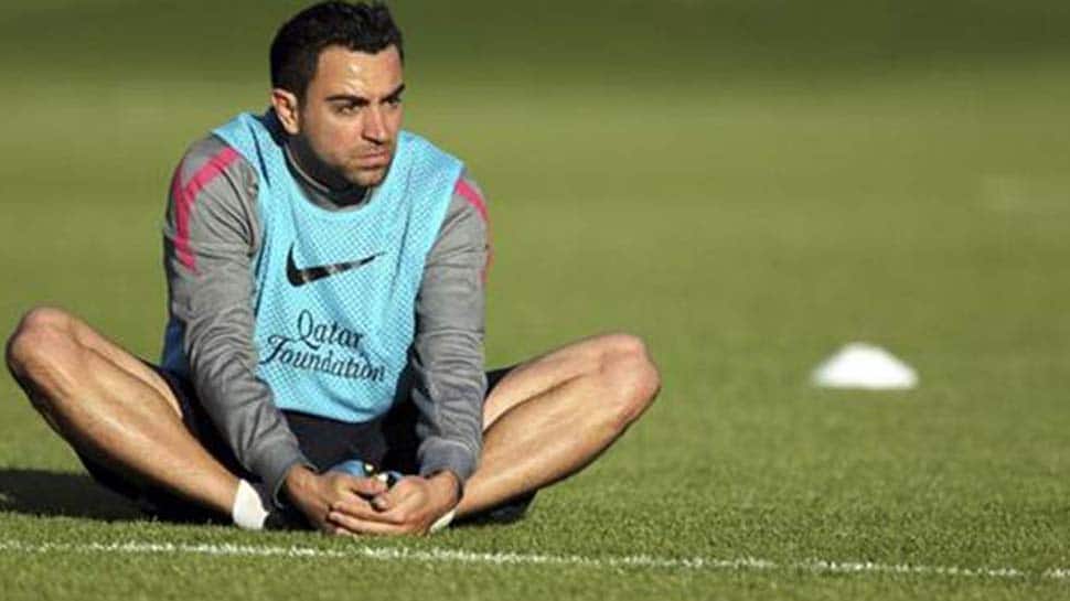 Spanish great Xavi to play on until at least end of year
