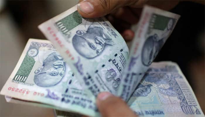 Rupee drops 7 paise to hit 15-month low of 67.20 against dollar