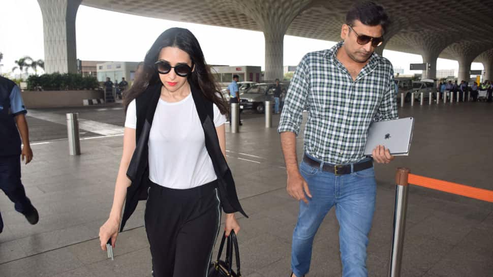 Karisma Kapoor spotted with rumoured beau Sandeep Toshniwal at the airport—See pics