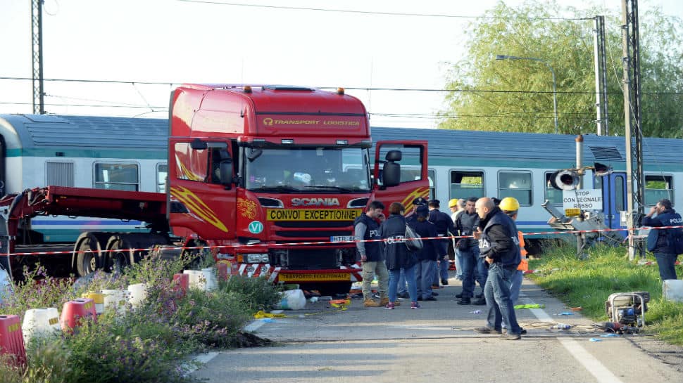 Two dead, 18 injured after train crashes into lorry in Italy