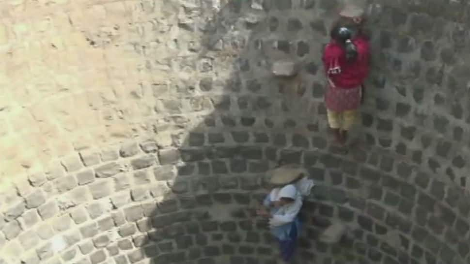 Watch: Water crisis forces children in MP village to walk 1 kilometer and climb down well