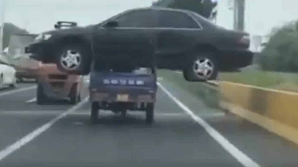 Man carries sedan car on a tiny three-wheeler in China - Video goes viral