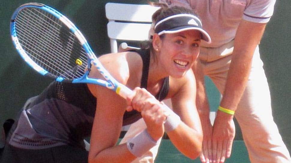 French Open: Garbine Muguruza through as Lesia Tsurenko retires hurt