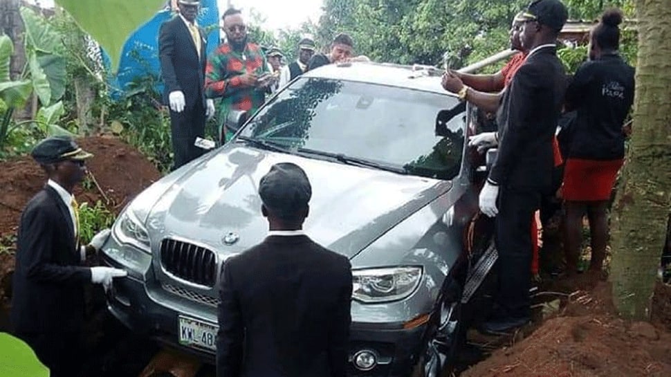 Nigerian man buries father in brand new BMW to honour him, photo goes viral