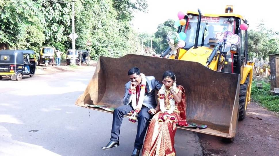 Forget the traditional &#039;Doli&#039;, a man takes wife home on a JCB vehicle post-wedding—See viral pics