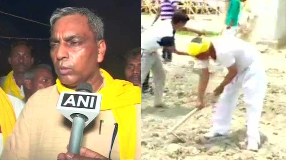 &#039;Miffed&#039; UP minister Om Prakash Rajbhar himself repairs road after authorities ignore his pleas  