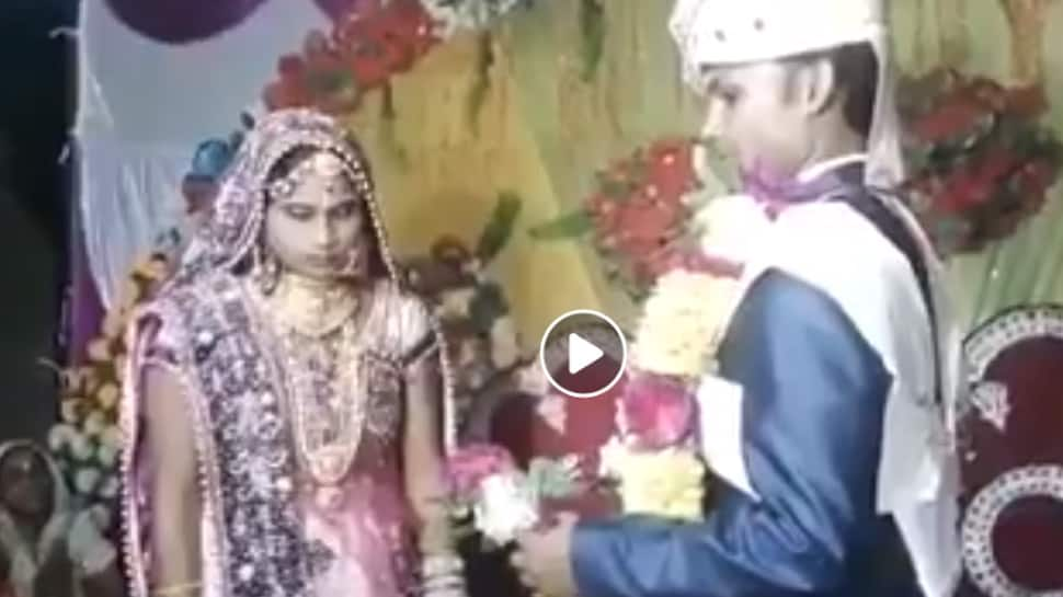 Groom &#039;throws&#039; garland around bride&#039;s neck in the most hilarious way—Watch