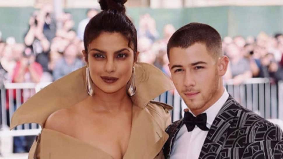 Priyanka Chopra clicks selfie with fan, Nick Jonas waits like a gentleman—Watch video