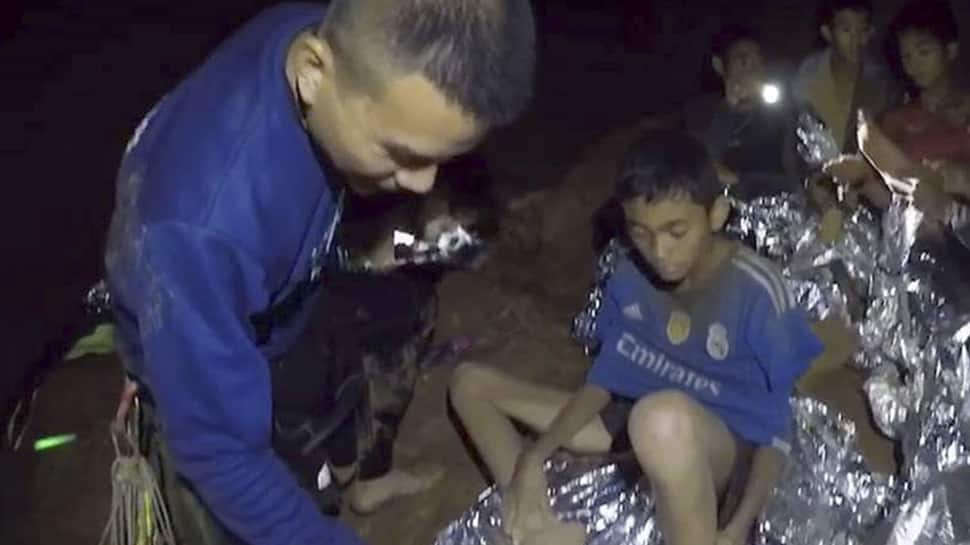 Thai children trapped in cave get diving lessons as rescuers weigh extraction