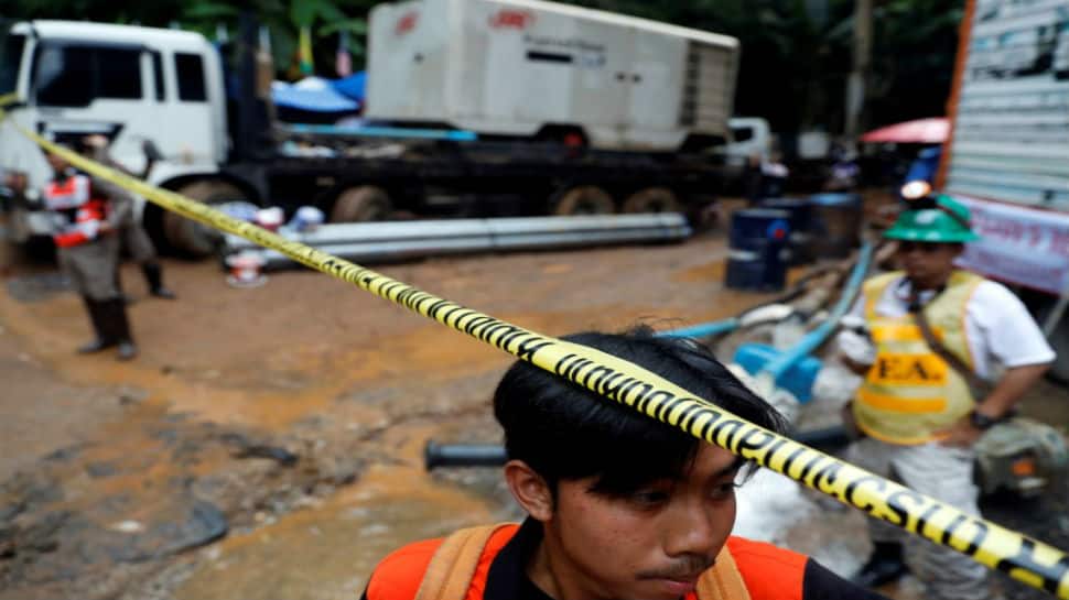 Rescuers fear more rain could hamper efforts to save 12 boys trapped in Thai cave