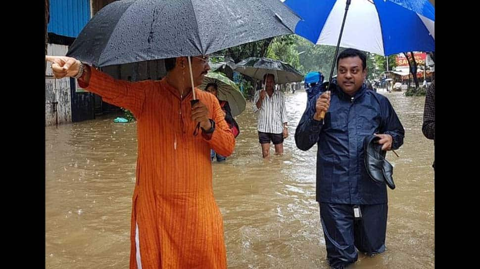 Sambit Patra&#039;s photo in knee-deep Mumbai rains goes viral, Congress smells BJP-Shiv Sena nexus