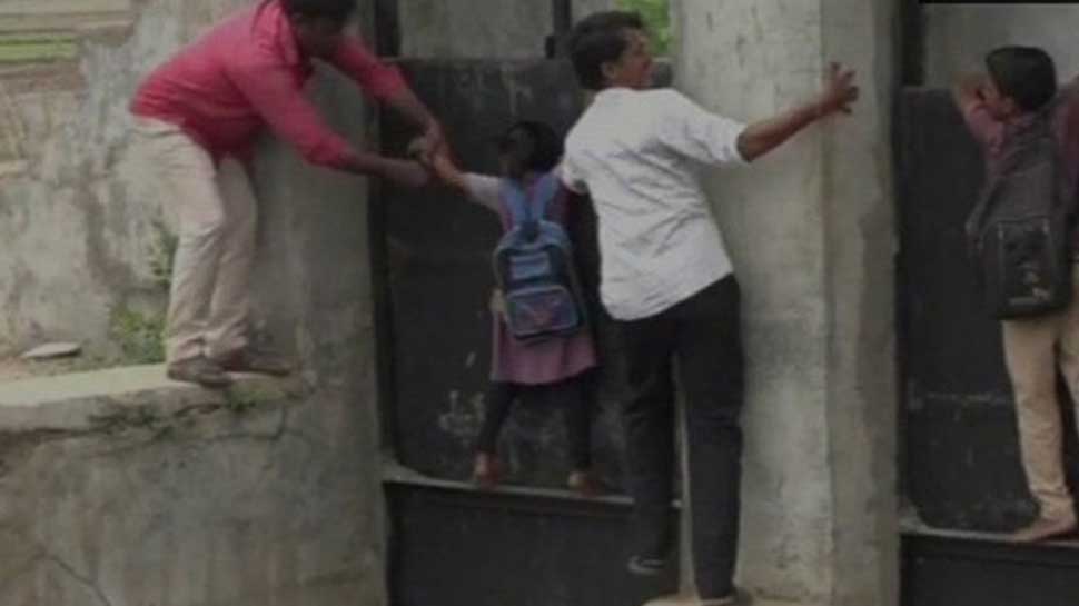 Locals risk lives, cross canal through collapsed bridge in Gujarat- WATCH