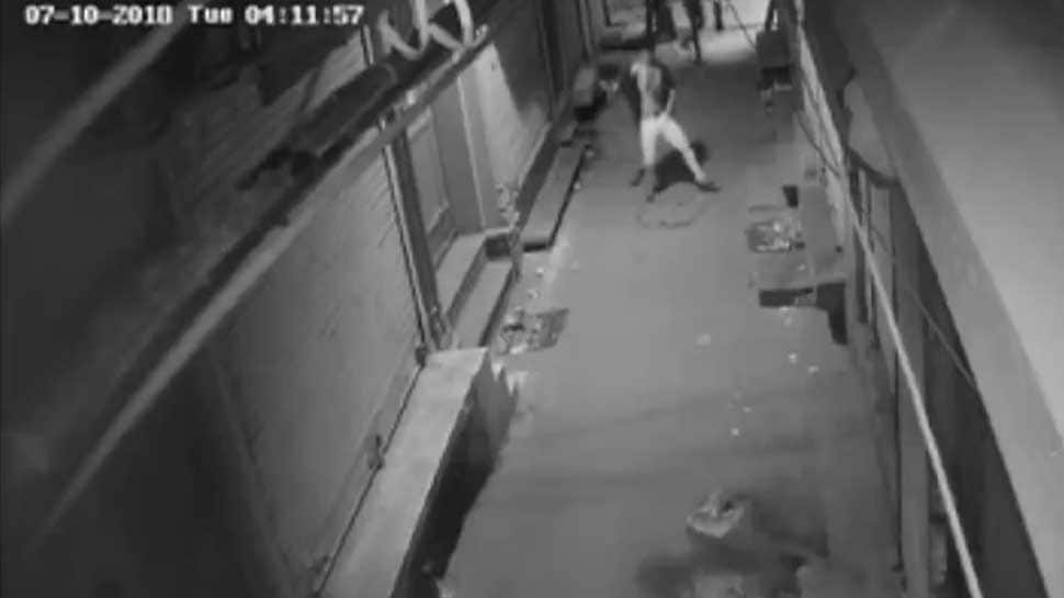 Thief caught on camera dancing before attempting to break into a shop in Delhi 