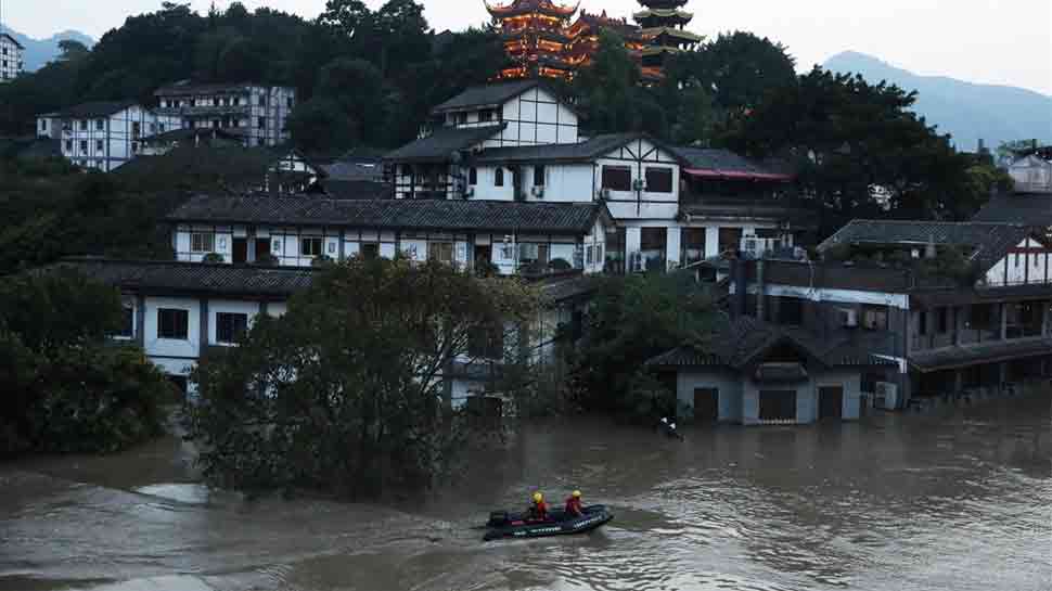 China floods wreak havoc, block roads and railways; more rain due