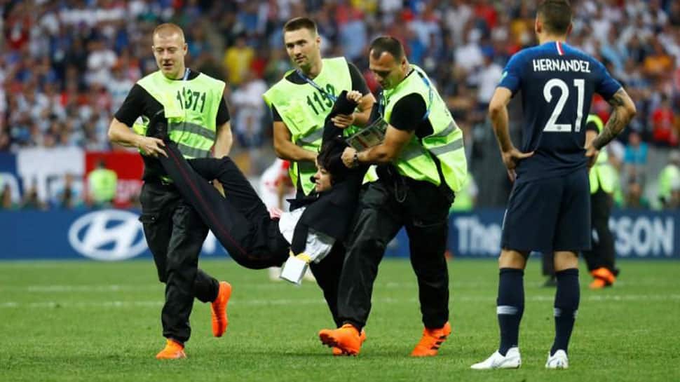 Intruders run on to pitch during World Cup final, Pussy Riot punk band claims responsibility