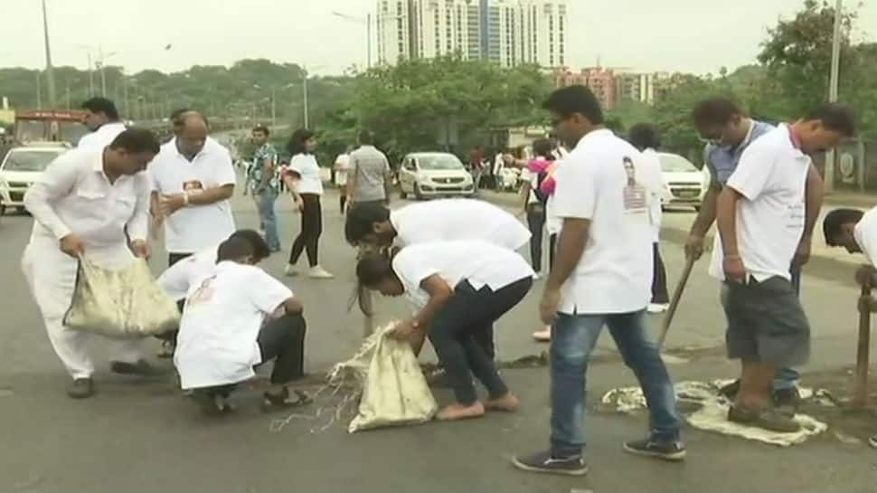 Mumbai man fills potholes for three years after losing son to road accident