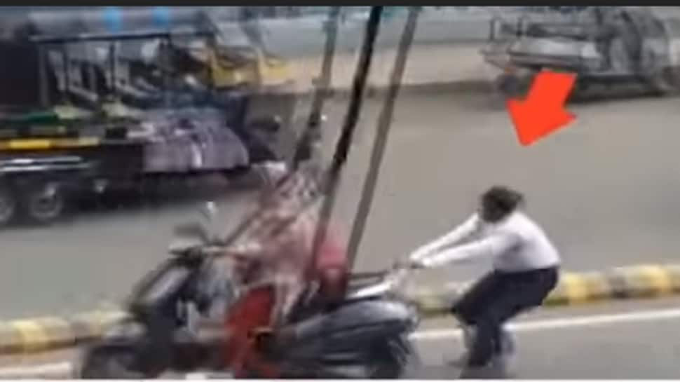 Watch: Woman constable holds on to speeding two-wheeler to catch errant female rider in Rajkot