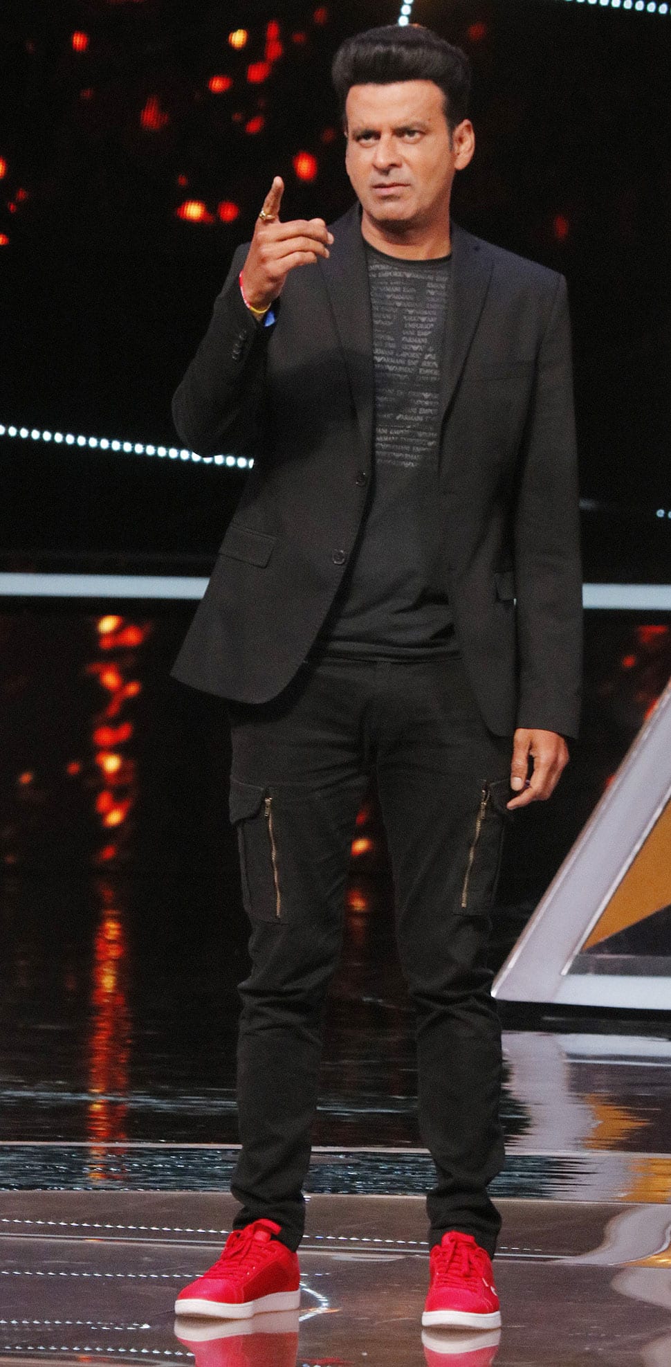 Manoj Bajpayee performs on stage.