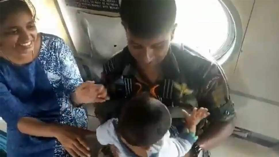 Watch: Garud commando airlifts baby from rooftop, hands it over to mother in flood-ravaged Kerala 