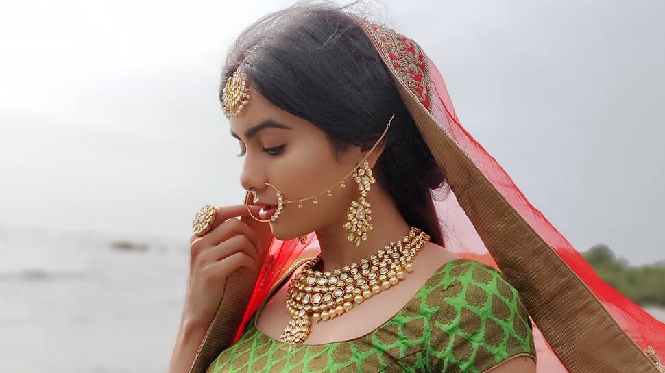 Adah Sharma stuns as a bride in these BTS pics from a photoshoot 