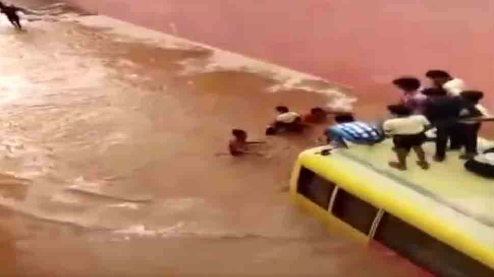 Bus carrying school students submerges in flooded road in Rajasthan — Watch