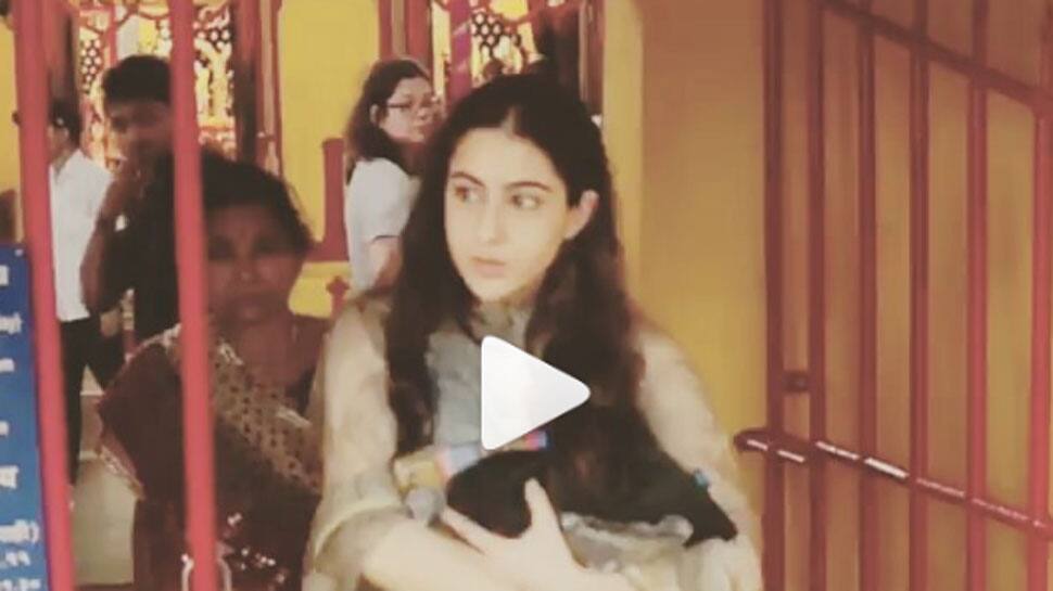 Sara Ali Khan tells photographer not to click pics as she makes donations outside a temple - Watch