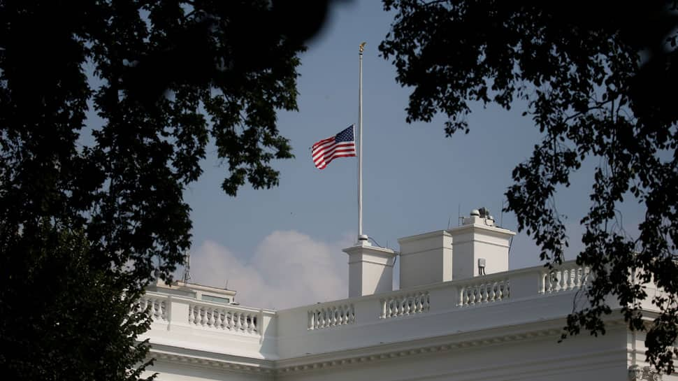 White House wobbles on US flag after McCain death