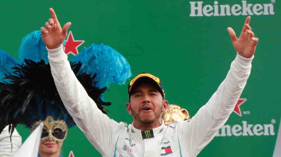 Lewis Hamilton wins as Sebastian Vettel spins in Ferrari&#039;s backyard