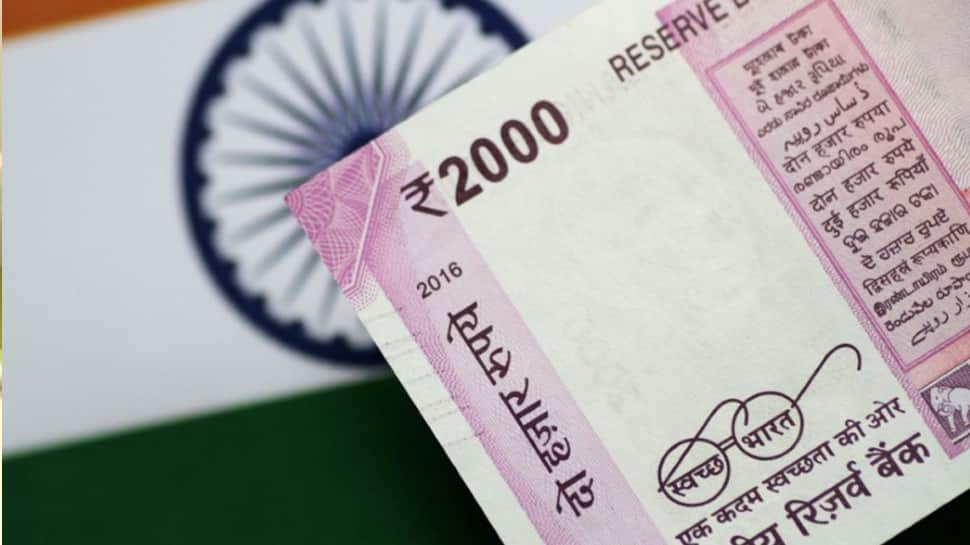 Rupee recovers from life-time low, up 20 paise against US dollar Rupee recovers from life-time low, up 20 paise against US dollar