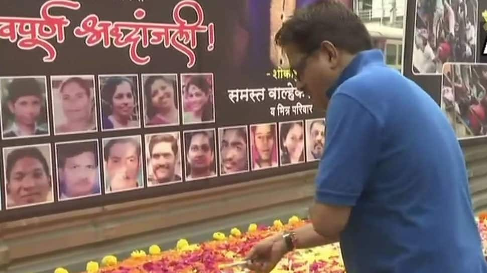 Mumbai: People pay tribute to victims on first anniversary of Elphinstone stampede