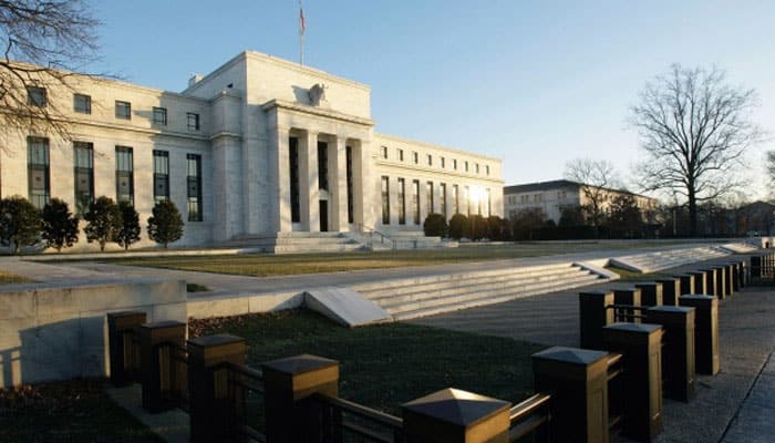 Fed holds interest rates steady, says economy remains on track