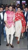 Ranveer Singh walks hand-in-hand with his bride Deepika Padukone at the airport.